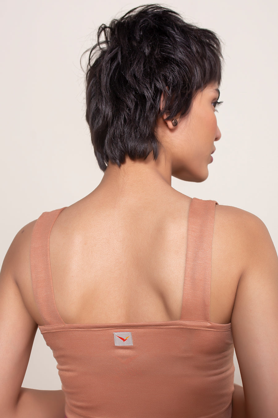 Women's Vera Crop in Brick | VOLO Apparel | The perfect athletic crop top made with a four way stretch bamboo fiber blend. Double lined and naturally odor resistant and antimicrobial. The Vera bamboo crop is reinforced stitched, the bamboo fiber comes with its own climate control properties, making the tops more breathable in the heat and more insulating in the cold.
