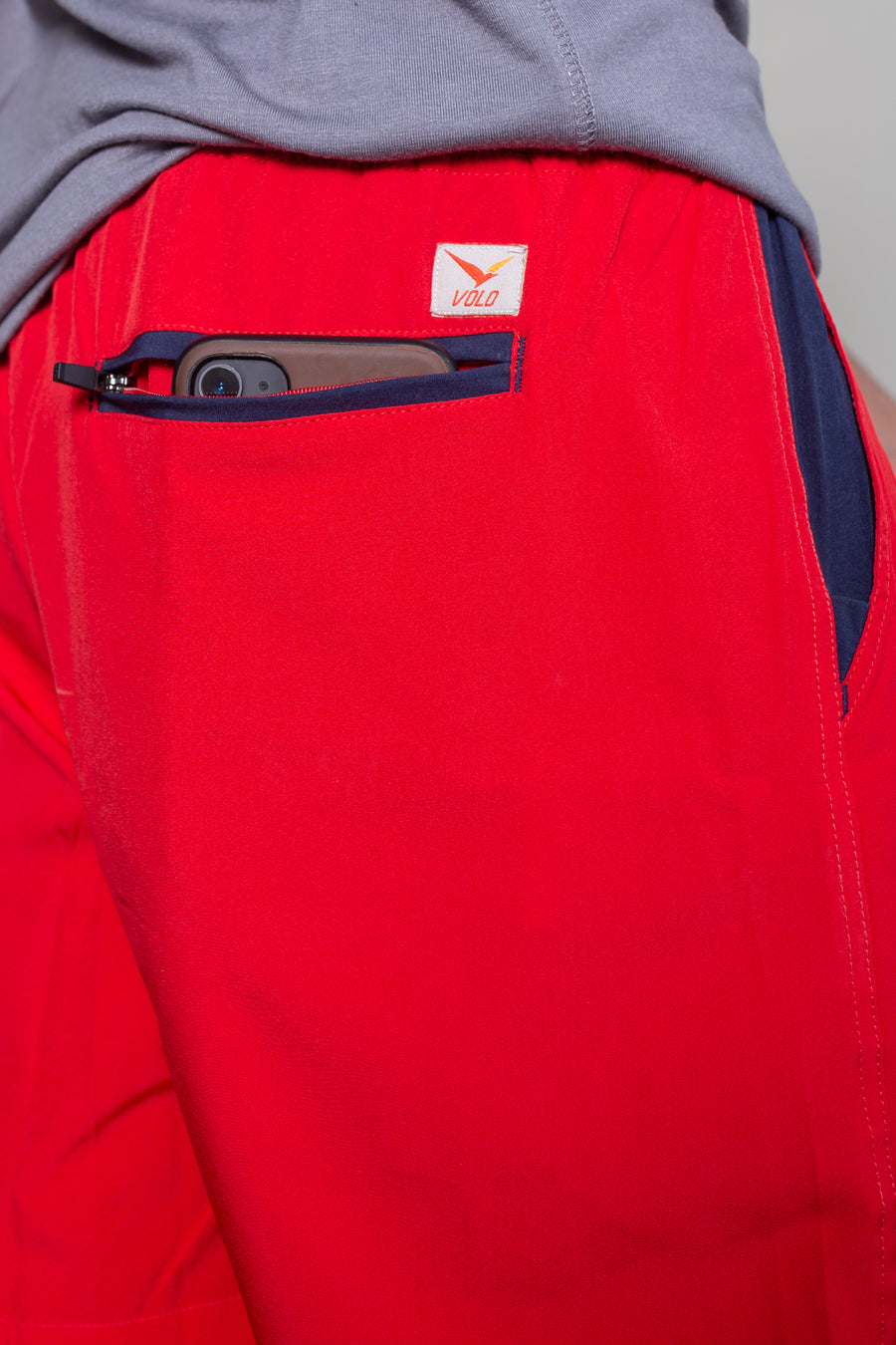 Men's Earth Shorts in Red | VOLO Apparel | Designed to fit into your active life without looking like athletic wear. Earth Shorts 2.0 come with a super strong ultralight microstretch fabric and a five pocket design. Two zipper pockets, a security pocket and super quick drying material. The shorts feature an internal drawstring and are reinforced stitched and ultra durable for all your adventures in or out of the city.
