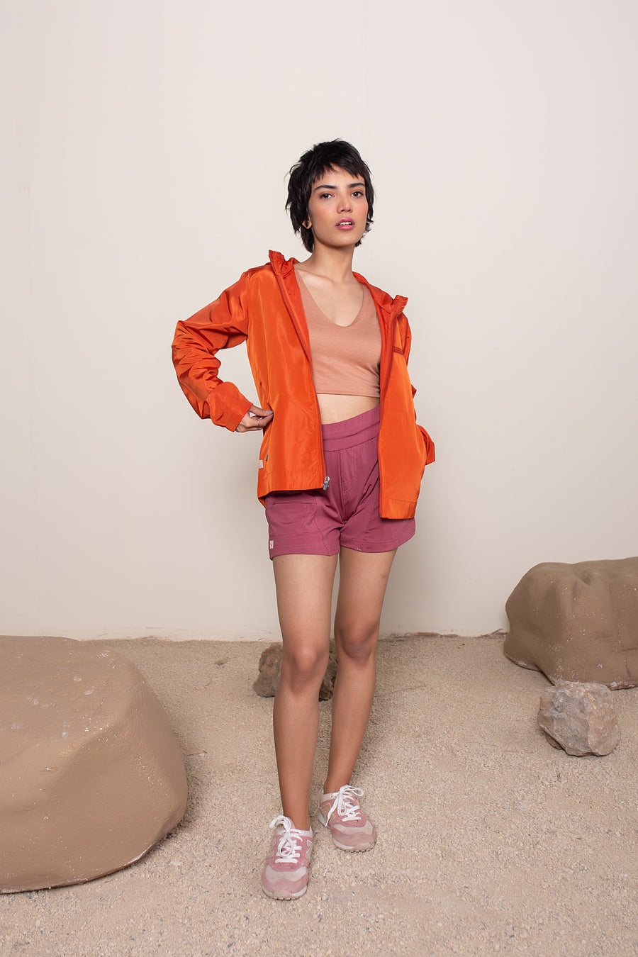 Women's Windansea Jacket in Orange | VOLO Apparel | The ultimate all year jacket, an ultralight hooded windbreaker, crafted with the revolutionary memory fabric and five pockets. This jacket is full of features, water repellant, three zipper pockets, UPF 50 protection from the sun and tailored fit to look super stylish while being ready for any adventure.