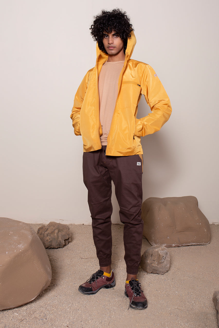 Men's Windansea Jacket in Golden | VOLO Apparel | The ultimate all year jacket, an ultralight hooded windbreaker, crafted with the revolutionary memory fabric and five pockets. This jacket is full of features, water repellant, three zipper pockets, UPF 50 protection from the sun and tailored fit to look super stylish while being ready for any adventure.