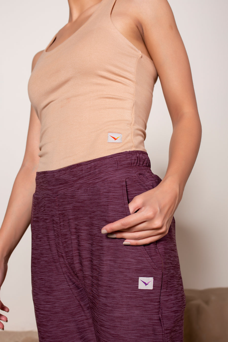 Women's Railay Yoga Jogger in Burgundy | VOLO Apparel | Railay Yoga Joggers have a slim but relaxed fit with a slightly cropped leg, hidden zippered pocket, deep side pockets, a secure cell phone pocket with a snap button and an internal drawstring. Designed with our premium peached four way stretch fabric, they're your new go-to yoga and do everything joggers.
