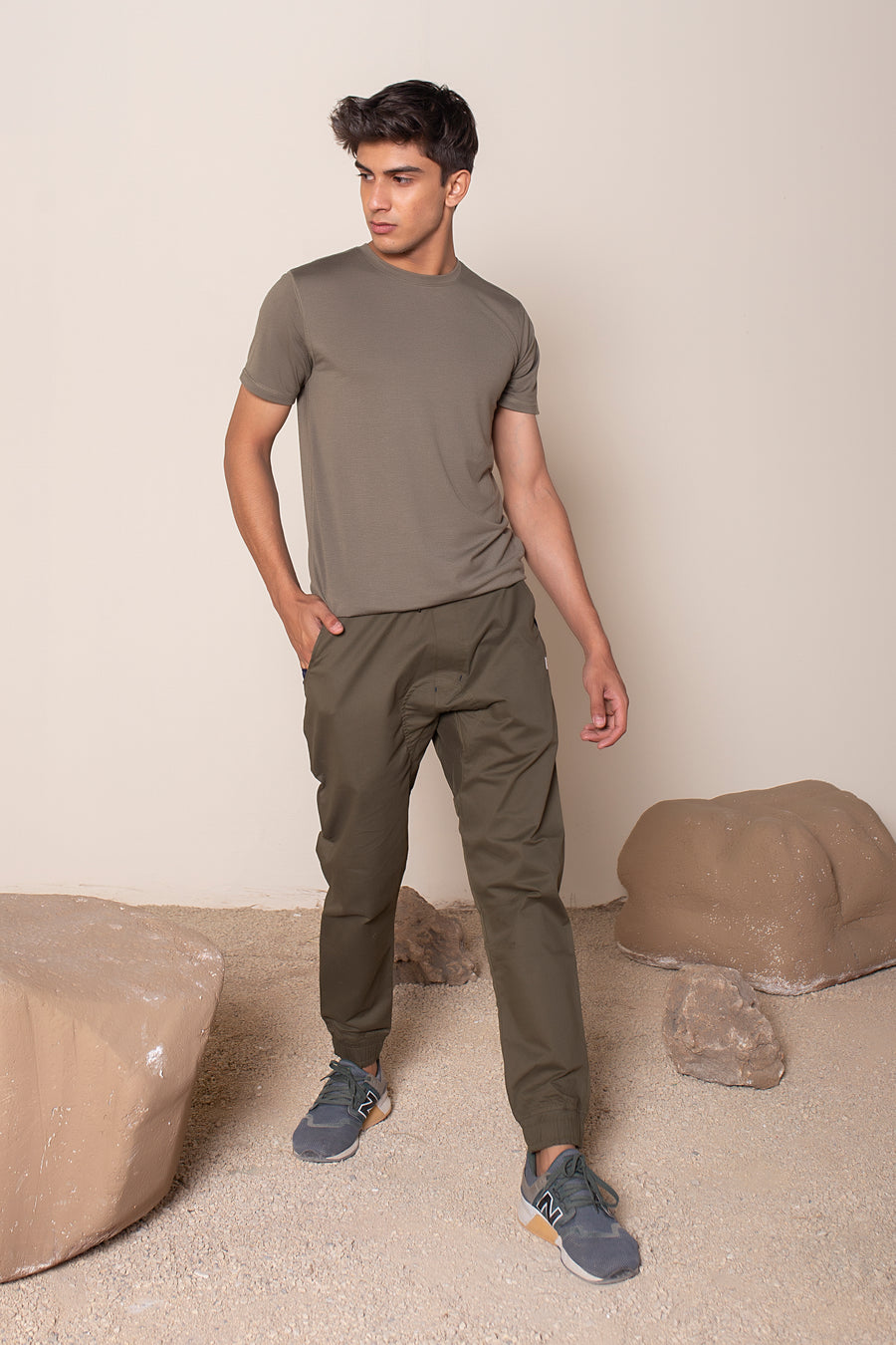 Men's Earth Joggers Olive Green | VOLO Apparel | Designed for you to rock climb, hike, yoga, run or just chill. The most versatile athletic joggers that are fitted for your every daily life and all your athletic endeavors. The Earth Joggers comes with five pockets, features a 3 point gusset, 2 zipper pockets, snap buttons, tapered bottoms, and a breathable stretchy spandex cotton twill. With an internal drawstring and a tailored fit, these are gonna be your go to adventure joggers.