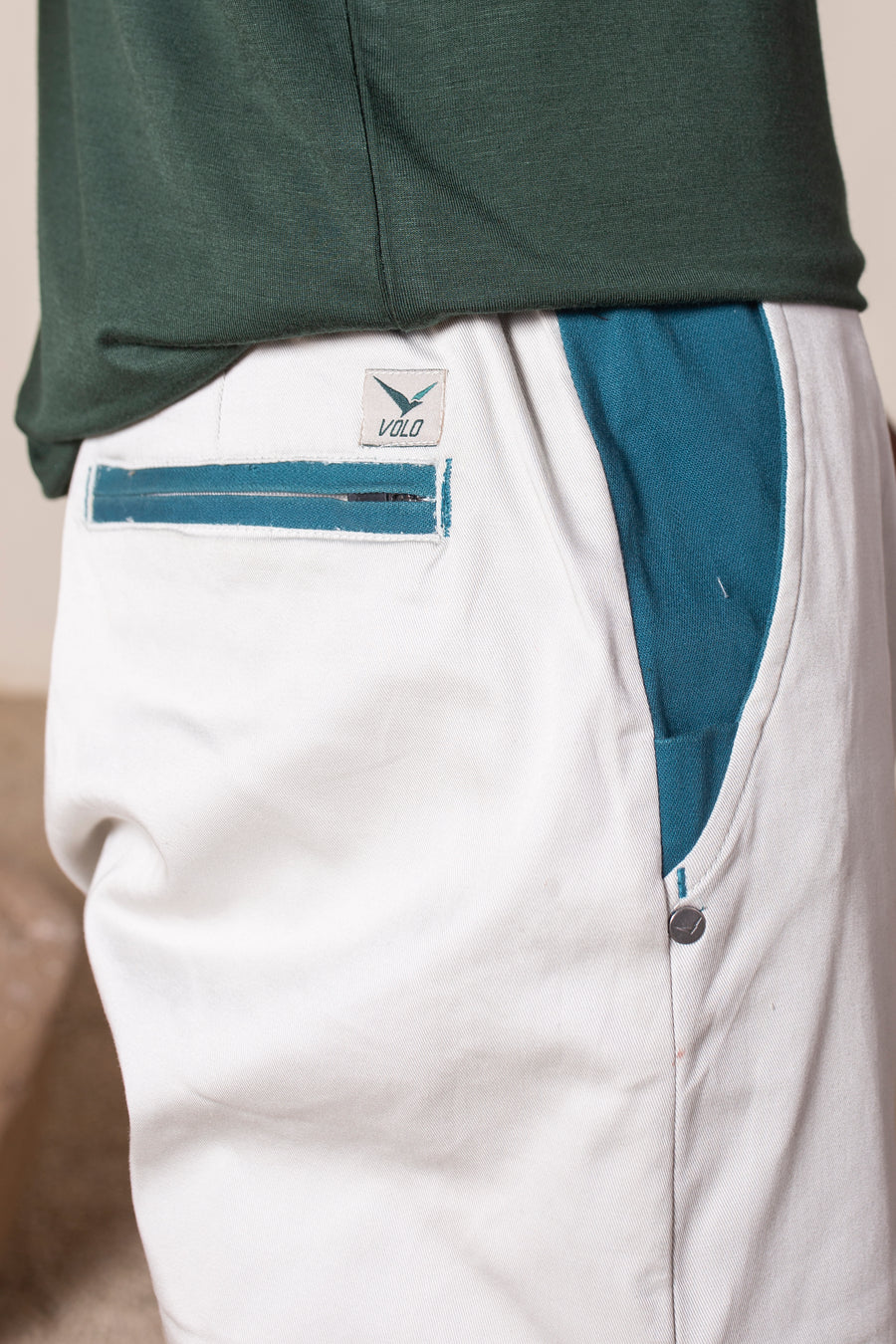 Men's Earth Joggers White | VOLO Apparel | Designed for you to rock climb, hike, yoga, run or just chill. The most versatile athletic joggers that are fitted for your every daily life and all your athletic endeavors. The Earth Joggers comes with five pockets, features a 3 point gusset, 2 zipper pockets, snap buttons, tapered bottoms, and a breathable stretchy spandex cotton twill. With an internal drawstring and a tailored fit, these are gonna be your go to adventure joggers.