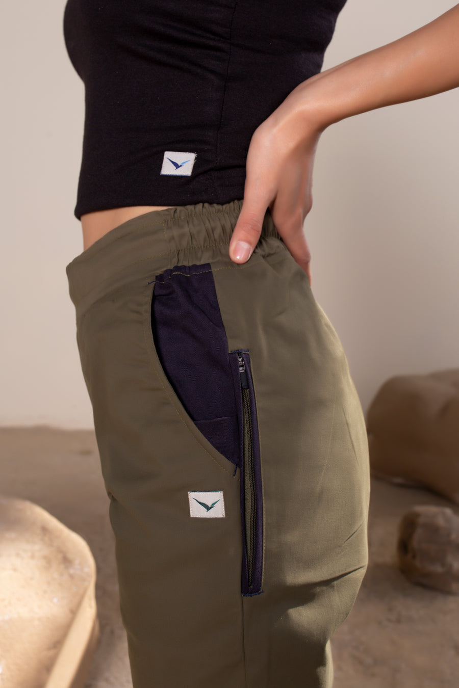 Women's Terra Joggers Olive Green | VOLO Apparel | Designed for you to rock climb, hike, yoga, run or just chill. The most versatile athletic joggers that are fitted for your every daily life and all your athletic endeavors. The Earth Joggers comes with five pockets, features a 3 point gusset, 2 zipper pockets, snap buttons, and a breathable stretchy spandex cotton twill. With an internal drawstring and a tailored fit, these are gonna be your go to adventure joggers.