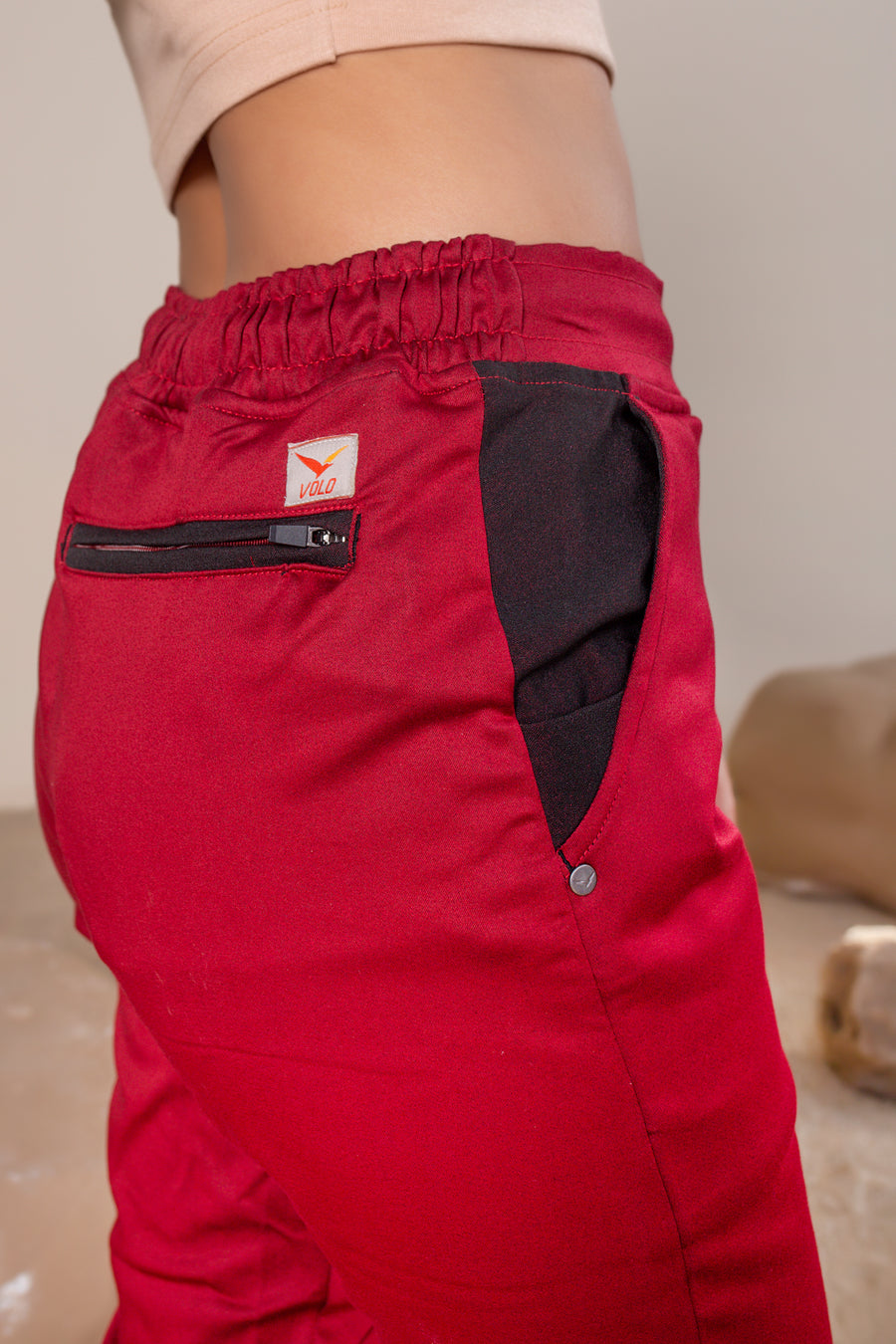Women's Terra Joggers Jasper Red | VOLO Apparel | Designed for you to rock climb, hike, yoga, run or just chill. The most versatile athletic joggers that are fitted for your every daily life and all your athletic endeavors. The Earth Joggers comes with five pockets, features a 3 point gusset, 2 zipper pockets, snap buttons, and a breathable stretchy spandex cotton twill. With an internal drawstring and a tailored fit, these are gonna be your go to adventure joggers.