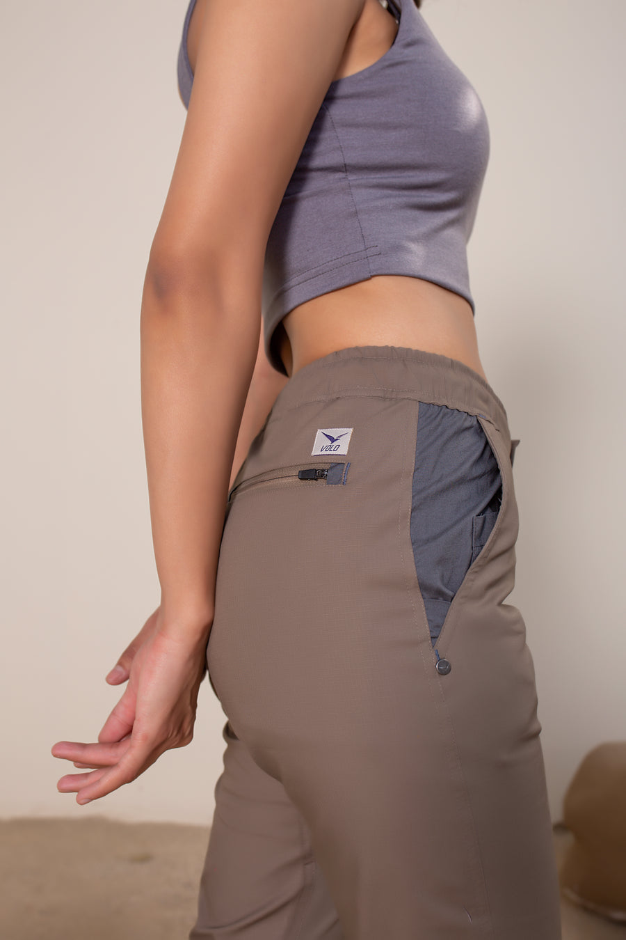 Women's Yosemite Rip Stop in Coffee | VOLO Apparel | Made with a durable stretch rip stop, the Yosemite Rip Stop pant is our ultimate six pocket lifestyle pant. Featuring a 3 point gusset, snap button security pockets, 2 zipper pockets and the comfort of cotton ripstop, these are your go to adventure pants. Designed to take you from the summit, to the city.