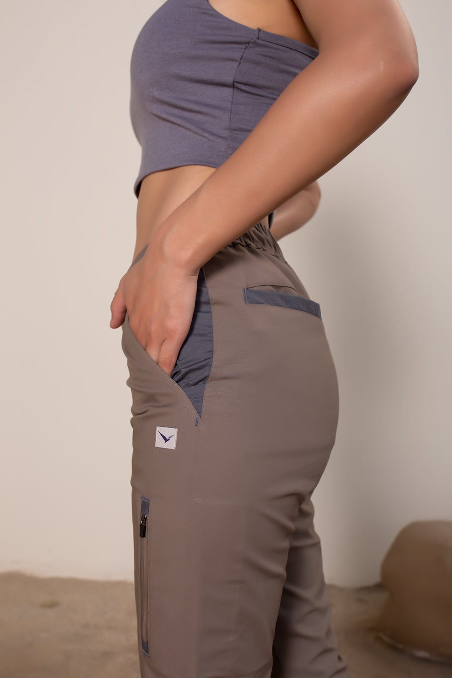 Women's Yosemite Rip Stop in Coffee | VOLO Apparel | Made with a durable stretch rip stop, the Yosemite Rip Stop pant is our ultimate six pocket lifestyle pant. Featuring a 3 point gusset, snap button security pockets, 2 zipper pockets and the comfort of cotton ripstop, these are your go to adventure pants. Designed to take you from the summit, to the city.