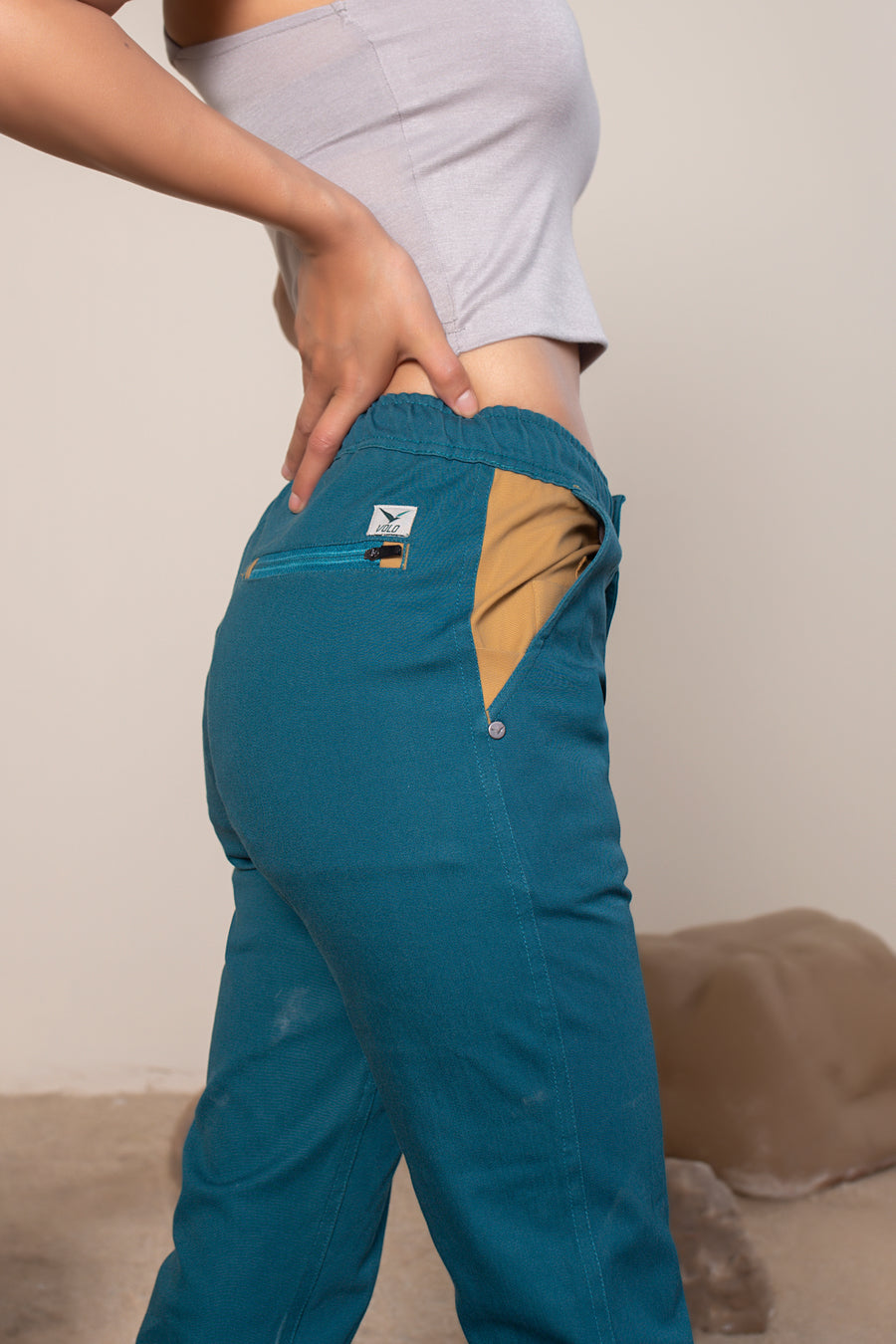 Women's Sequoia Canvas Pant in Teal | VOLO Apparel | Made with an ultra durable stretch cotton canvas, the Sequoia Canvas Pant is our ultimate six pocket lifestyle pant. Featuring a modern slim fit and a 33 inch inseam, a 3 point gusset, snap button security pockets, 2 zipper pockets and the comfort of durable canvas, these are your go to adventure pants that can handle anything you throw at them.