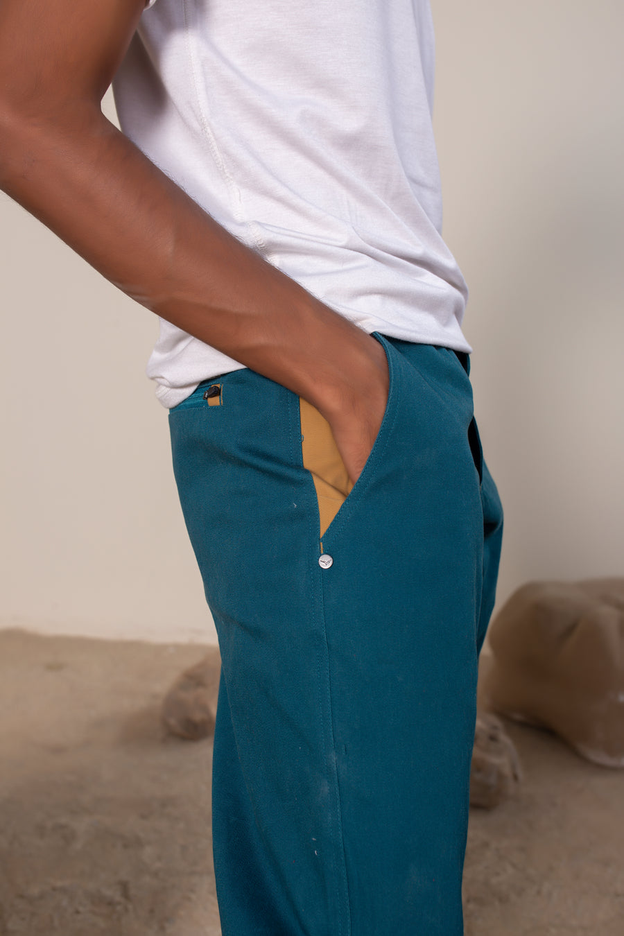 Men's Sequoia Canvas Pant in Teal | VOLO Apparel | Made with an ultra durable stretch cotton canvas, the Sequoia Canvas Pant is our ultimate six pocket lifestyle pant. Featuring a modern slim fit and a 33 inch inseam, a 3 point gusset, snap button security pockets, 2 zipper pockets and the comfort of durable canvas, these are your go to adventure pants that can handle anything you throw at them.