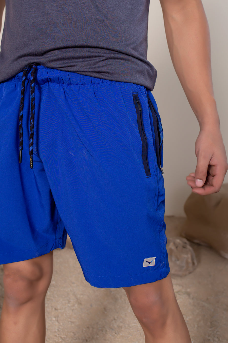 Men's Flight Shorts in Lapis Blue | VOLO Apparel | Designed so you can feel fly and completely secure, the Flight Shorts 2.0 are made with an ultralight micro stretch fabric that is quick drying and comes with a three zipper pocket design. The smart pocket tech makes it so your stuff won’t bounce when you do. Reinforced stitching so it can handle everything you will throw at it. The one short for your every adventure.