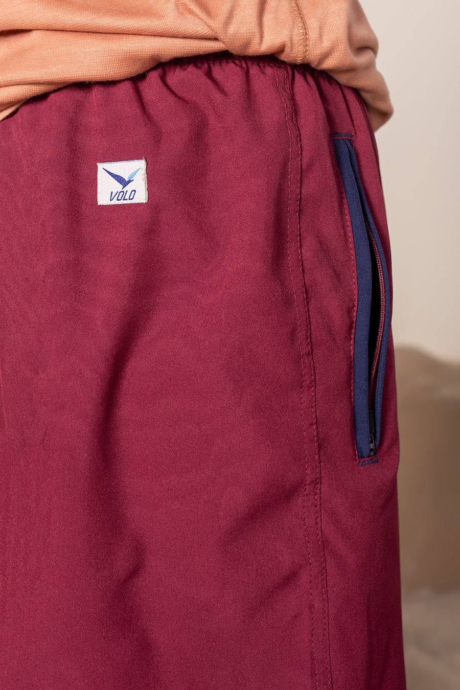 Men's Flight Shorts in Maroon | VOLO Apparel | Designed so you can feel fly and completely secure, the Flight Shorts 2.0 are made with an ultralight micro stretch fabric that is quick drying and comes with a three zipper pocket design. The smart pocket tech makes it so your stuff won’t bounce when you do. Reinforced stitching so it can handle everything you will throw at it. The one short for your every adventure.