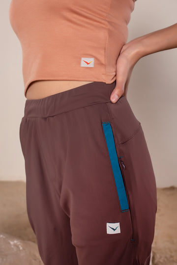 Women's Wanderlust Pant Brown | VOLO Apparel | These pants are designed to give you wanderlust, an ultralight super durable athletic pant with a five pocket design, a 3 point gusset for all your movements and a high ankle tapered bottom. The revolutional Italian nylon is patented with UPF 50 protection and extreme breathability. The one pant to go everywhere and do everything!