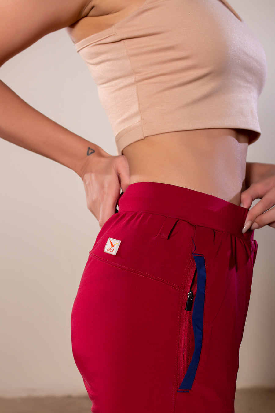Women's Wanderlust Pant Maroon | VOLO Apparel | These pants are designed to give you wanderlust, an ultralight super durable athletic pant with a five pocket design, a 3 point gusset for all your movements and a high ankle tapered bottom. The revolutional Italian nylon is patented with UPF 50 protection and extreme breathability. The one pant to go everywhere and do everything!