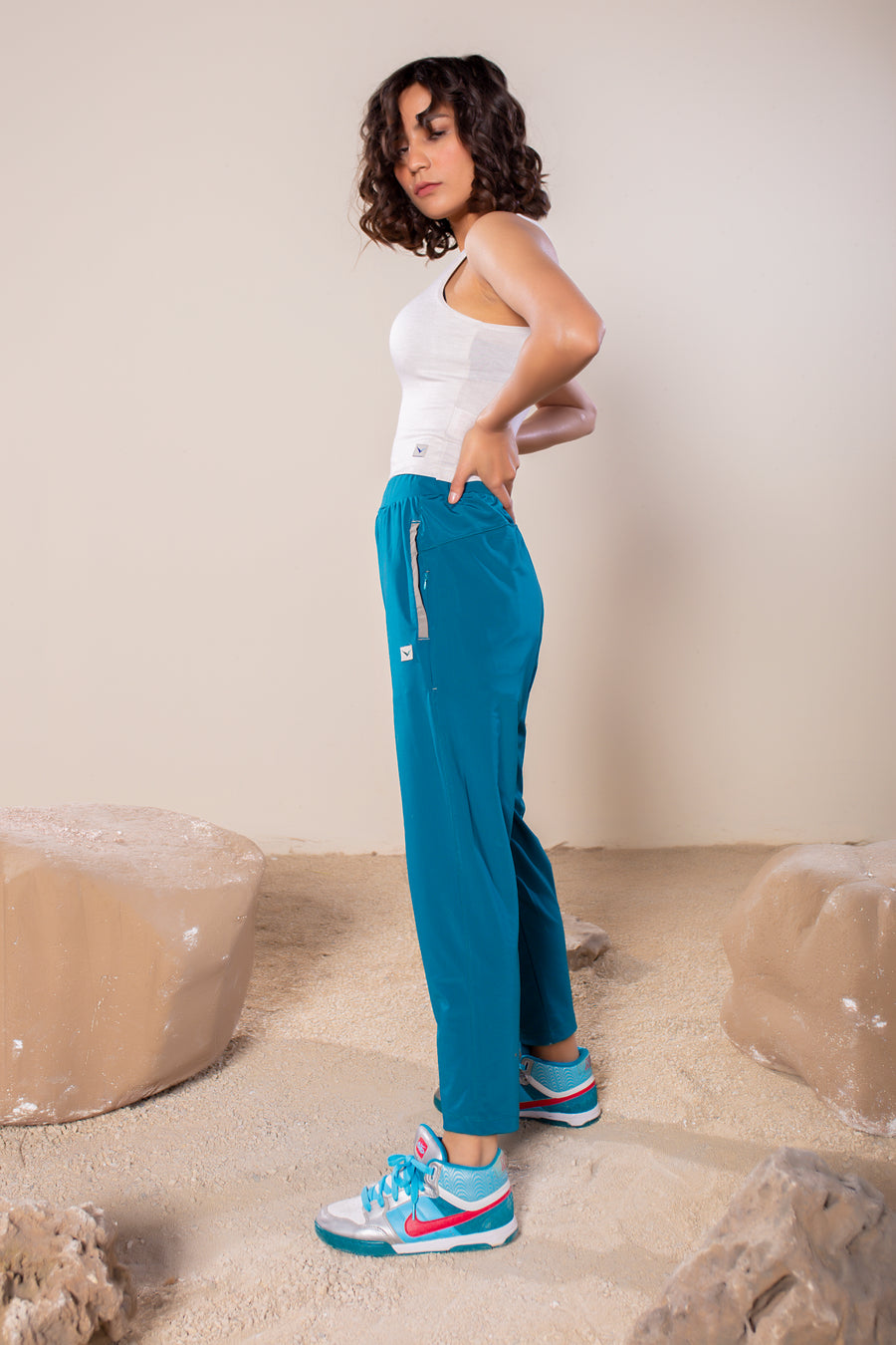 Women's Wanderlust Pant Tropical Teal | VOLO Apparel | These pants are designed to give you wanderlust, an ultralight super durable athletic pant with a five pocket design, a 3 point gusset for all your movements and a high ankle tapered bottom. The revolutional Italian nylon is patented with UPF 50 protection and extreme breathability. The one pant to go everywhere and do everything!