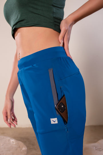 Women's Wanderlust Pant Blue Teal | VOLO Apparel | These pants are designed to give you wanderlust, an ultralight super durable athletic pant with a five pocket design, a 3 point gusset for all your movements and a high ankle tapered bottom. The revolutional Italian nylon is patented with UPF 50 protection and extreme breathability. The one pant to go everywhere and do everything!